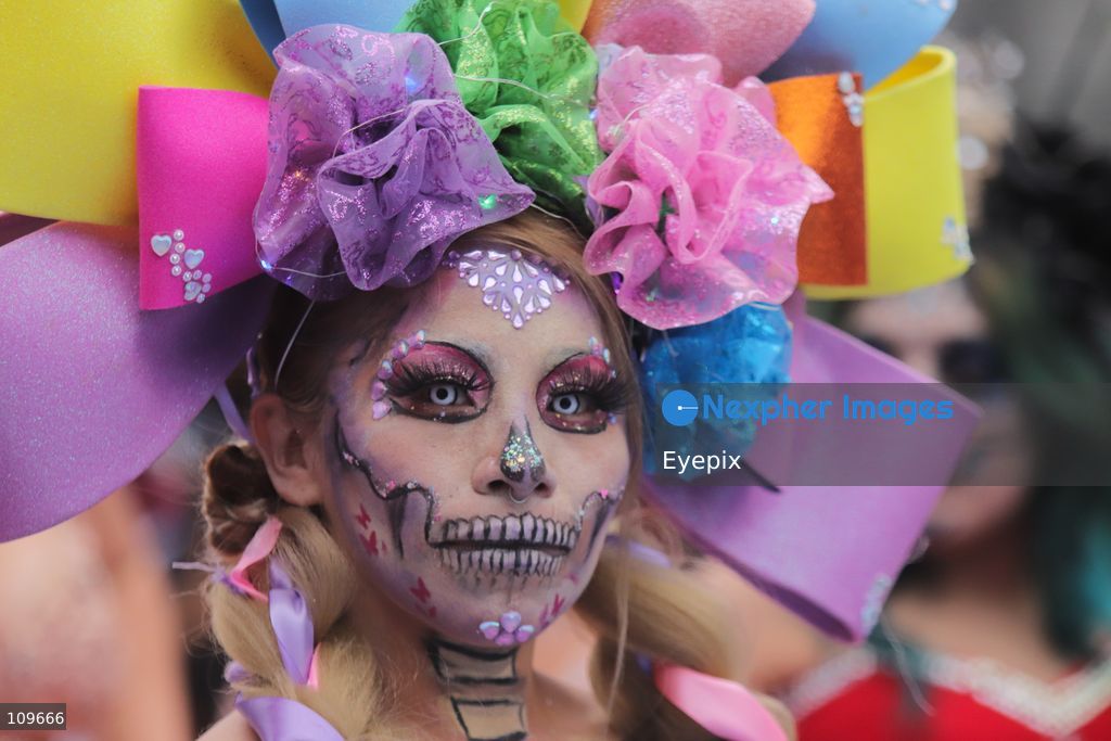 A woman with her face painted with Catrina makeup takes part during the 13th annual Mega Procession of Catrinas along Paseo de la Reforma avenue. Thousands of persons gathered for the massive parade, a key cultural prelude to the upcoming Day of the Dead (Día de Muertos) celebrations, showcasing elaborate makeup, vibrant costumes, and honoring Mexican skull iconography. on October 25, 2026 in Mexico City, Mexico. (Photo by Carlos Santiago/ Eyepix Group/Eyepix via Nexpher Images)