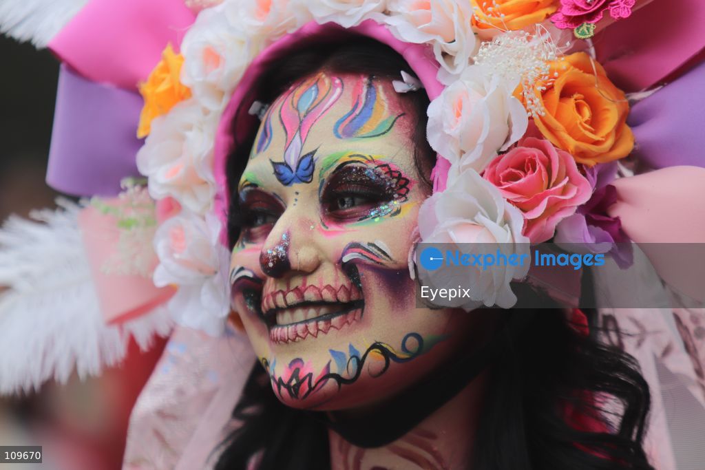 A woman with her face painted with Catrina makeup takes part during the 13th annual Mega Procession of Catrinas along Paseo de la Reforma avenue. Thousands of persons gathered for the massive parade, a key cultural prelude to the upcoming Day of the Dead (Día de Muertos) celebrations, showcasing elaborate makeup, vibrant costumes, and honoring Mexican skull iconography. on October 25, 2026 in Mexico City, Mexico. (Photo by Carlos Santiago/ Eyepix Group/Eyepix via Nexpher Images)