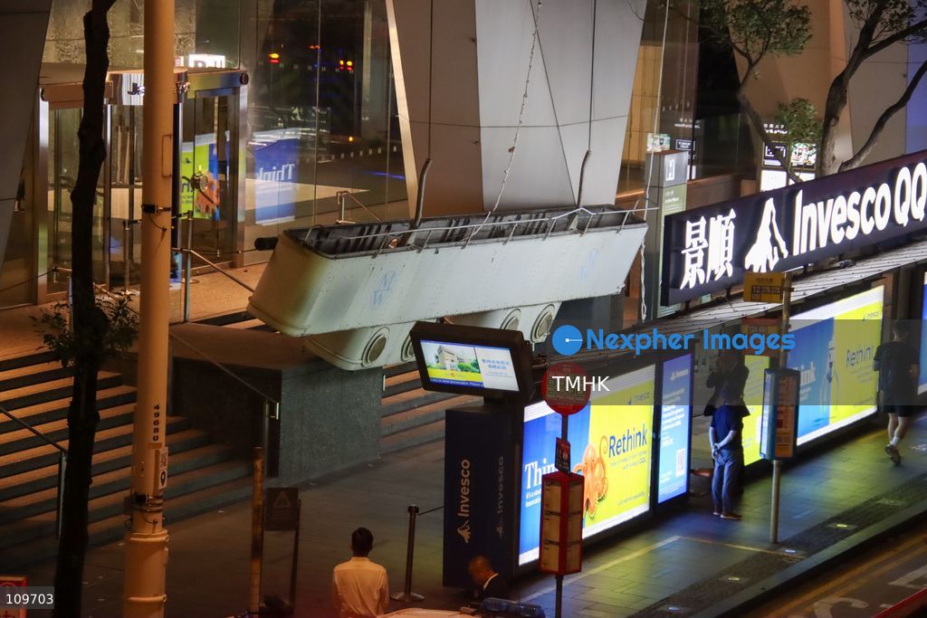 A suspended working platform hangs near ground level outside Jardine House in Central, Hong Kong, on October 26, 2026, after it suddenly plunged, leaving two workers stranded high on the building's exterior. Both workers were subsequently rescued by firefighters. (Photo by Gordon Choi/TMHK via Nexpher Images)