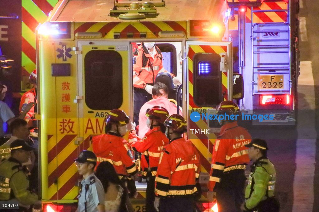 Firefighters, police officers and paramedics attend the scene of a suspended working platform accident outside Jardine House in Central, Hong Kong, on October 26, 2026. Two workers were left stranded on the building's exterior at the 35th and 43rd floors before being rescued by firefighters. (Photo by Gordon Choi/TMHK via Nexpher Images)