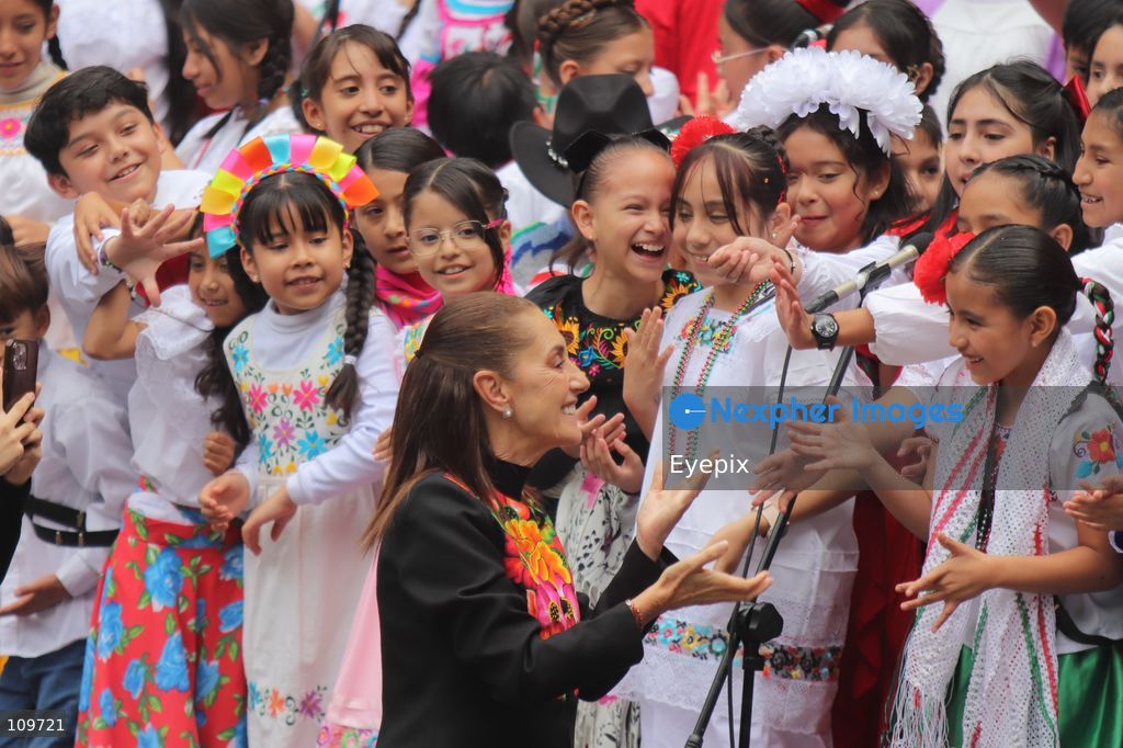 Mexico’s President Claudia Sheinbaum Pardo greets children from a school choir, dressed in traditional regional costumes during the presentation of the first National School Choir Contest (Primer Concurso Nacional de Coros Escolares) inside the Main Patio at the National Palace on October 26, 2026 in Mexico City, Mexico. (Photo by Carlos Santiago/ Eyepix Group/Eyepix via Nexpher Images)