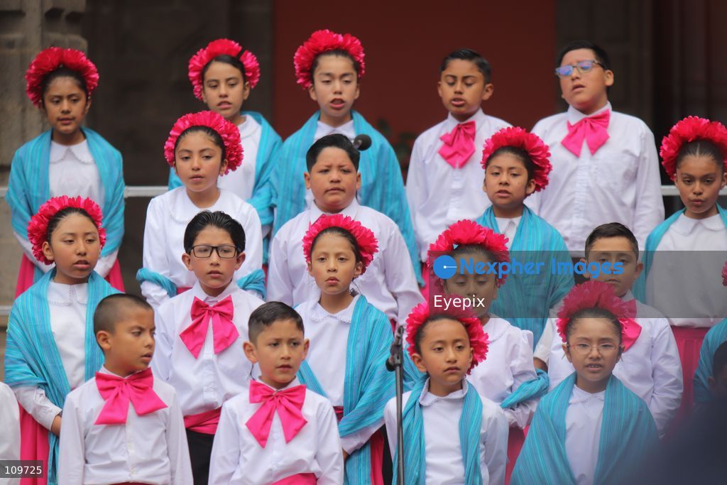 Children from a school choir, dressed in traditional regional costumes sing during the presentation of the first National School Choir Contest (Primer Concurso Nacional de Coros Escolares) inside the Main Patio at the National Palace on October 26, 2026 in Mexico City, Mexico. (Photo by Carlos Santiago/ Eyepix Group/Eyepix via Nexpher Images)