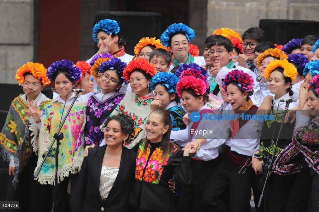 Mexico’s President Claudia Sheinbaum Pardo greets children from a school choir, dressed in traditional regional costumes during the presentation of the first National School Choir Contest (Primer Concurso Nacional de Coros Escolares) inside the Main Patio at the National Palace on October 26, 2026 in Mexico City, Mexico. (Photo by Carlos Santiago/ Eyepix Group/Eyepix via Nexpher Images)