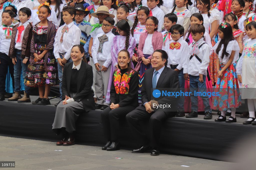 (L-R) Secretary of Culture Claudia Curiel de Icaza, Mexican President Claudia Sheinbaum and Secretary of Public Education Mario Delgado attend the presentation of the first National School Choir Contest (Primer Concurso Nacional de Coros Escolares) inside the Main Patio at the National Palace on October 26, 2026 in Mexico City, Mexico. (Photo by Carlos Santiago/ Eyepix Group/Eyepix via Nexpher Images)