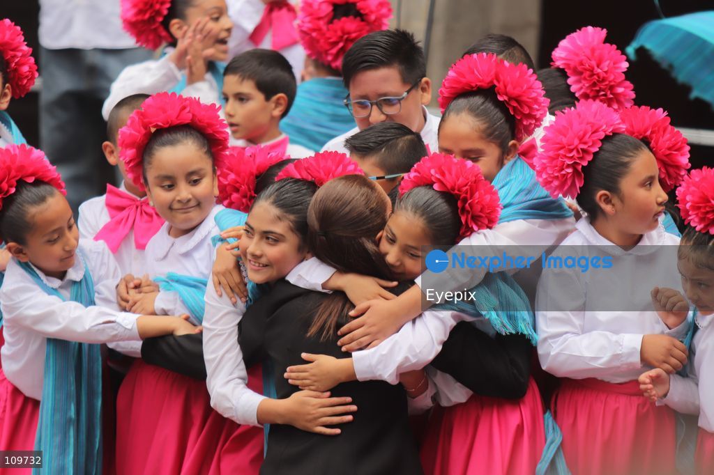 Mexico’s President Claudia Sheinbaum Pardo hugs children from a school choir, dressed in traditional regional costumes during the presentation of the first National School Choir Contest (Primer Concurso Nacional de Coros Escolares) inside the Main Patio at the National Palace on October 26, 2026 in Mexico City, Mexico. (Photo by Carlos Santiago/ Eyepix Group/Eyepix via Nexpher Images)
