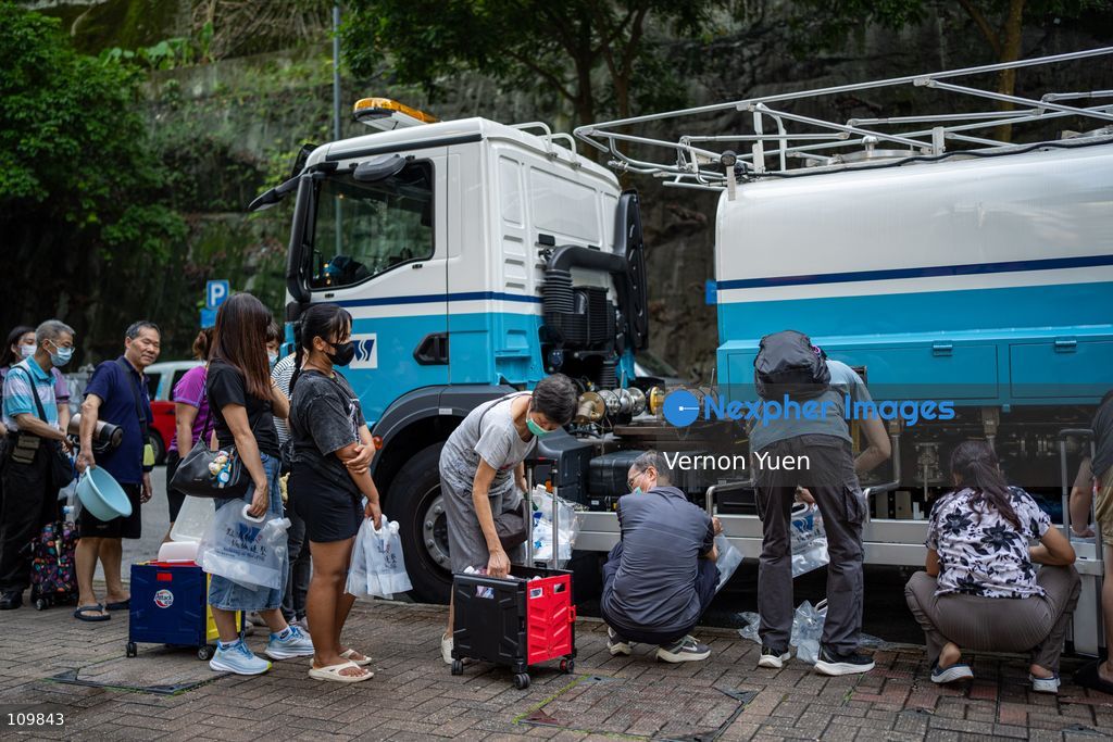 Residents lining up at a water truck after a water main burst in Shau Kei Wan on October 27, 2026 in Hong Kong. (Photo by Vernon Yuen/Nexpher Images)