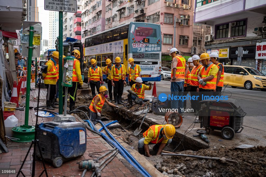 Construction workers fixing a broken water main after a water main burst in Shau Kei Wan on October 27, 2026 in Hong Kong. (Photo by Vernon Yuen/Nexpher Images)