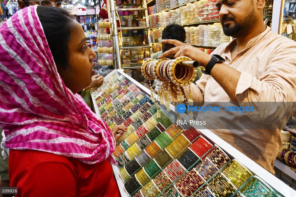 PRAYAGRAJ, INDIA - OCTOBER 27, 2026: A woman buys bangles ahead of the upcoming Karwa Chauth festival in Prayagraj. (Photo by Saurabh Kumar/JNA Press via Nexpher Images)