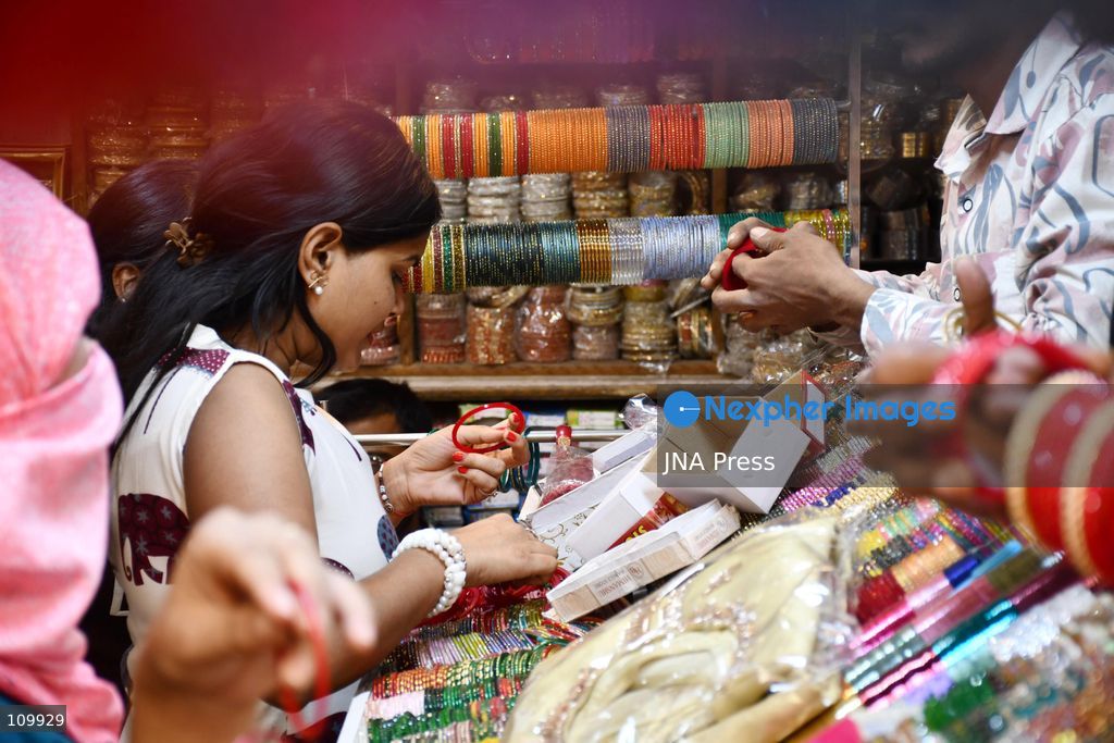 PRAYAGRAJ, INDIA - OCTOBER 27, 2026: A woman buys bangles ahead of the upcoming Karwa Chauth festival in Prayagraj. (Photo by Saurabh Kumar/JNA Press via Nexpher Images)