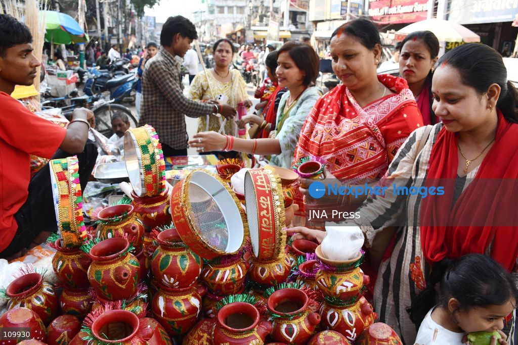 PRAYAGRAJ, INDIA - OCTOBER 27, 2026: A woman buys bangles ahead of the upcoming Karwa Chauth festival in Prayagraj. (Photo by Saurabh Kumar/JNA Press via Nexpher Images)