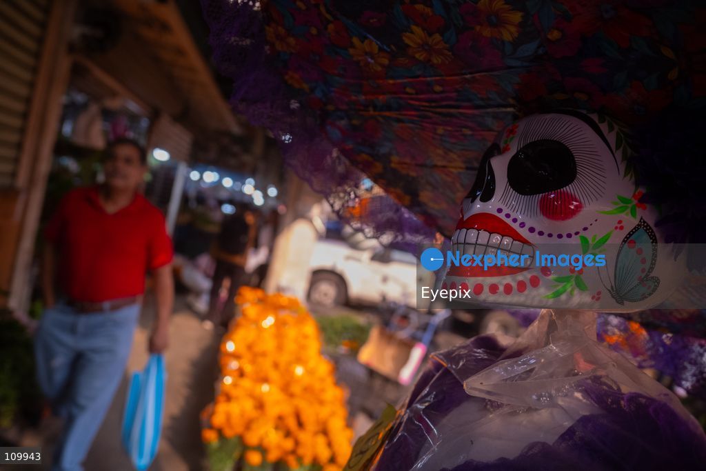 Handcrafted papier-mâché skulls, are displayed for sale to customers preparing for the upcoming Day of the Dead (Dia de Muertos) celebrations at the Jamaica Market on October 26, 2026 in Mexico City, Mexico. The traditional market experiences a massive influx of shoppers sourcing flowers, incense, sugar skulls, and altar decorations to honor their deceased loved ones ahead of the annual holiday celebrated on November 1 and 2. (Photo by Marko Gonzalez/ Eyepix Group/Eyepix via Nexpher Images)