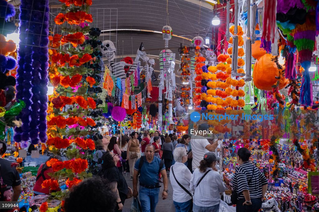 Customers visit the Jamaica Market preparing for the upcoming Day of the Dead (Dia de Muertos) celebrations on October 26, 2026 in Mexico City, Mexico. The traditional market experiences a massive influx of shoppers sourcing flowers, incense, sugar skulls, and altar decorations to honor their deceased loved ones ahead of the annual holiday celebrated on November 1 and 2. (Photo by Marko Gonzalez/ Eyepix Group/Eyepix via Nexpher Images)