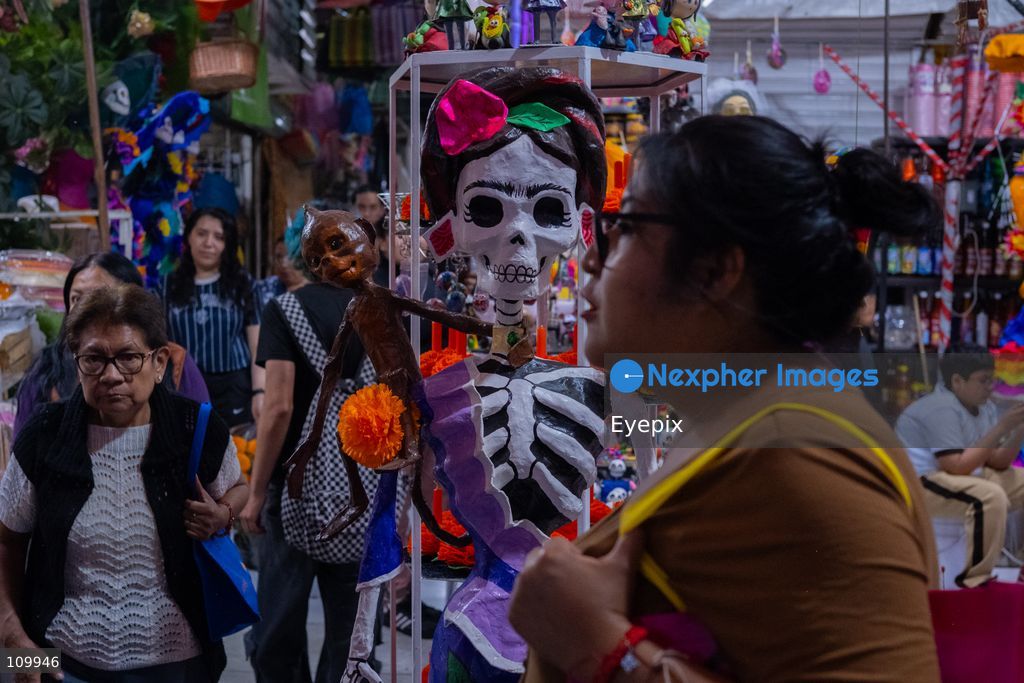 Customers visit the Jamaica Market preparing for the upcoming Day of the Dead (Dia de Muertos) celebrations on October 26, 2026 in Mexico City, Mexico. The traditional market experiences a massive influx of shoppers sourcing flowers, incense, sugar skulls, and altar decorations to honor their deceased loved ones ahead of the annual holiday celebrated on November 1 and 2. (Photo by Marko Gonzalez/ Eyepix Group/Eyepix via Nexpher Images)