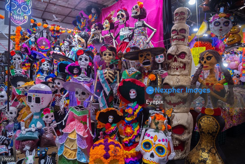 Handcrafted papier-mâché skeletons and Catrinas, are displayed for sale to customers preparing for the upcoming Day of the Dead (Dia de Muertos) celebrations at the Jamaica Market on October 26, 2026 in Mexico City, Mexico. The traditional market experiences a massive influx of shoppers sourcing flowers, incense, sugar skulls, and altar decorations to honor their deceased loved ones ahead of the annual holiday celebrated on November 1 and 2. (Photo by Marko Gonzalez/ Eyepix Group/Eyepix via Nexpher Images)