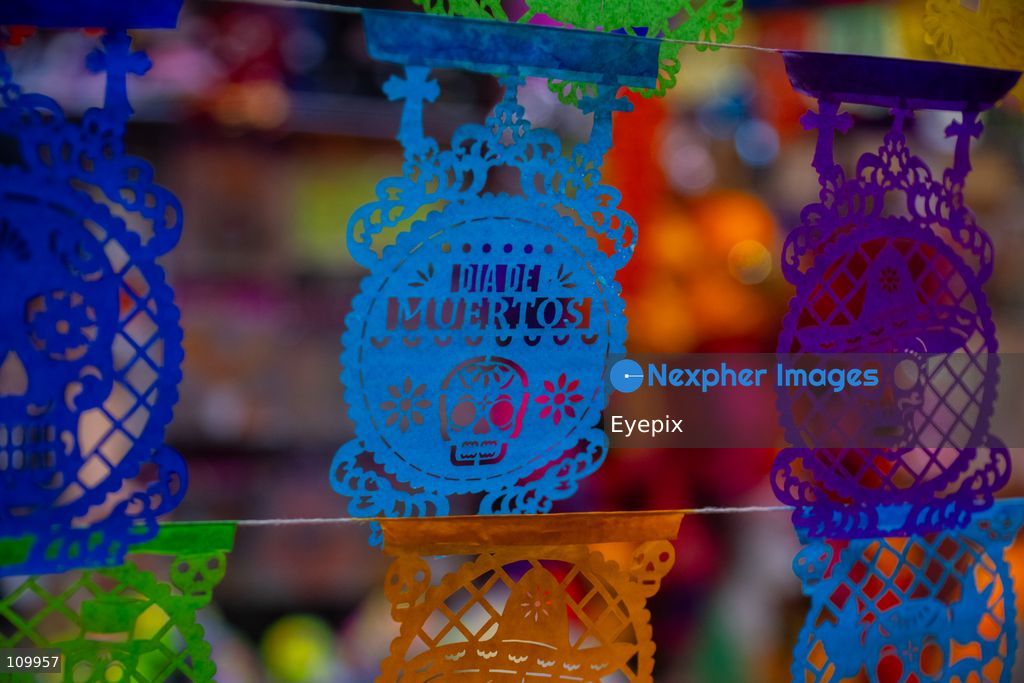 Stalls display colorful papel picado (traditional chiseled tissue paper) for sale to customers preparing for the upcoming Day of the Dead (Dia de Muertos) celebrations at the Jamaica Marke on October 26, 2026 in Mexico City, Mexico. The traditional market experiences a massive influx of shoppers sourcing flowers, incense, sugar skulls, and altar decorations to honor their deceased loved ones ahead of the annual holiday celebrated on November 1 and 2. (Photo by Marko Gonzalez/ Eyepix Group/Eyepix via Nexpher Images)