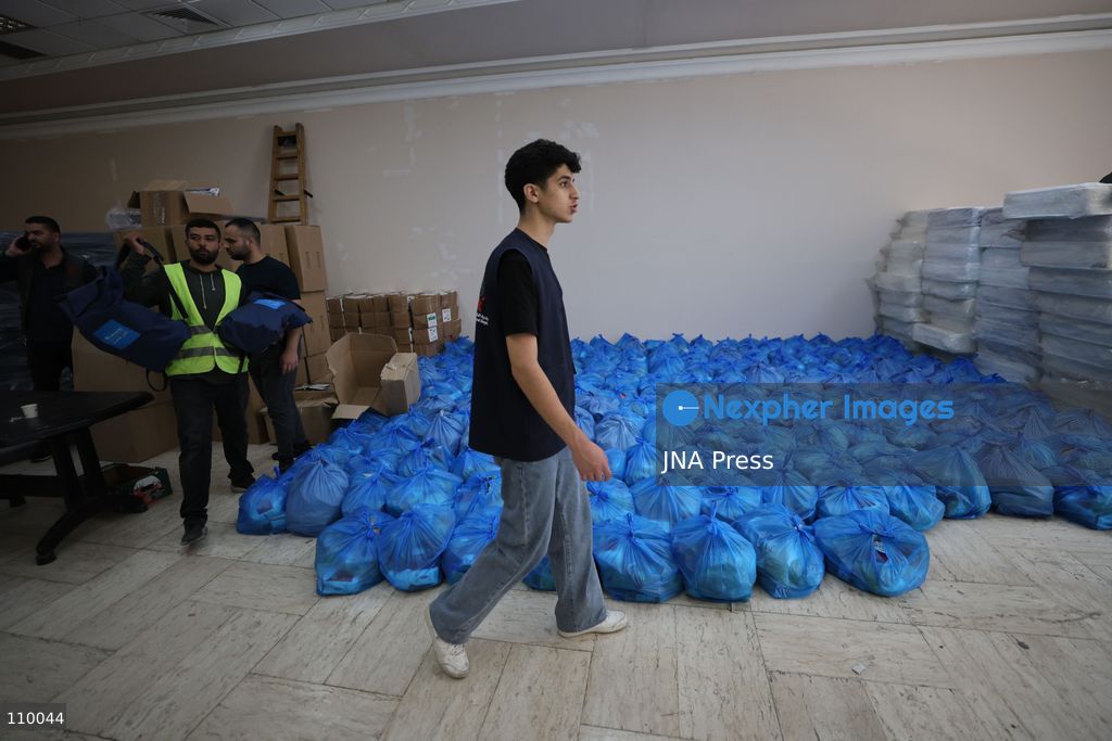 HEBRON, PALESTINE, OCTOBER 28, 2026: Relief workers collect and distribute food, medical supplies, clothing and bedding for Palestinian families displaced from the Deir Baha and Al-Jilda areas of Hebron in the occupied West Bank. The relief effort supports residents forced from their homes during an Israeli military operation that began on October 23. (Photo by Mosab shawer/JNA Press via Nexpher Images)