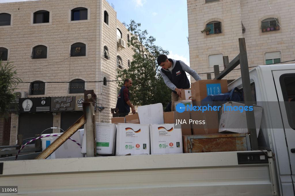 HEBRON, PALESTINE, OCTOBER 28, 2026: Relief workers collect and distribute food, medical supplies, clothing and bedding for Palestinian families displaced from the Deir Baha and Al-Jilda areas of Hebron in the occupied West Bank. The relief effort supports residents forced from their homes during an Israeli military operation that began on October 23. (Photo by Mosab shawer/JNA Press via Nexpher Images)