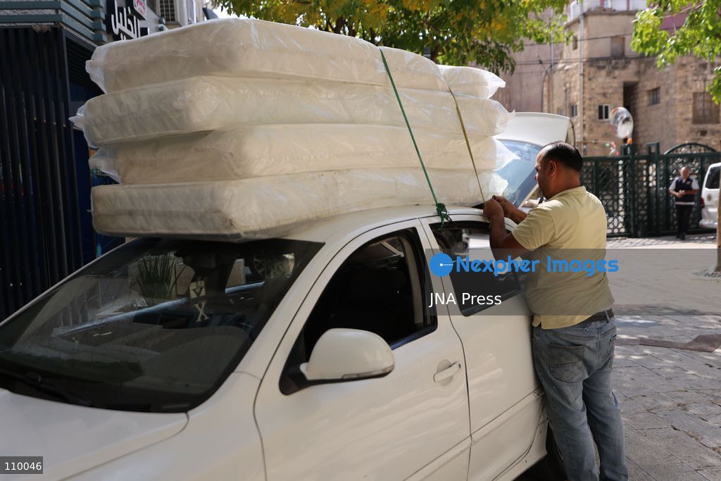 HEBRON, PALESTINE, OCTOBER 28, 2026: Relief workers collect and distribute food, medical supplies, clothing and bedding for Palestinian families displaced from the Deir Baha and Al-Jilda areas of Hebron in the occupied West Bank. The relief effort supports residents forced from their homes during an Israeli military operation that began on October 23. (Photo by Mosab shawer/JNA Press via Nexpher Images)