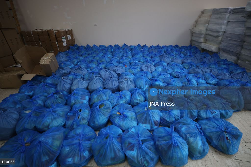 HEBRON, PALESTINE, OCTOBER 28, 2026: Relief workers collect and distribute food, medical supplies, clothing and bedding for Palestinian families displaced from the Deir Baha and Al-Jilda areas of Hebron in the occupied West Bank. The relief effort supports residents forced from their homes during an Israeli military operation that began on October 23. (Photo by Mosab shawer/JNA Press via Nexpher Images)
