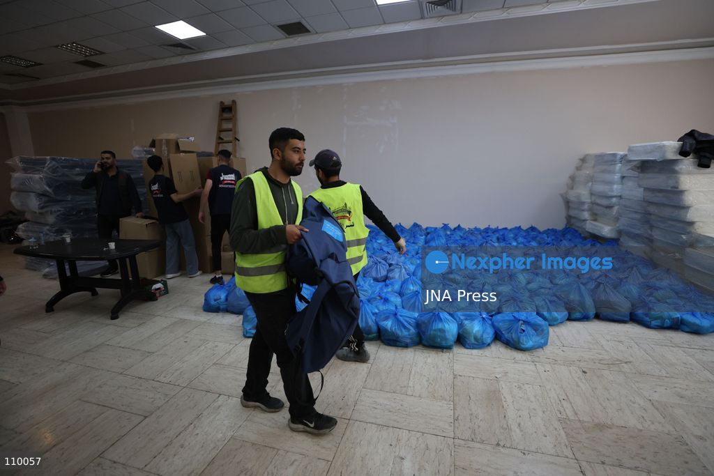 HEBRON, PALESTINE, OCTOBER 28, 2026: Relief workers collect and distribute food, medical supplies, clothing and bedding for Palestinian families displaced from the Deir Baha and Al-Jilda areas of Hebron in the occupied West Bank. The relief effort supports residents forced from their homes during an Israeli military operation that began on October 23. (Photo by Mosab shawer/JNA Press via Nexpher Images)