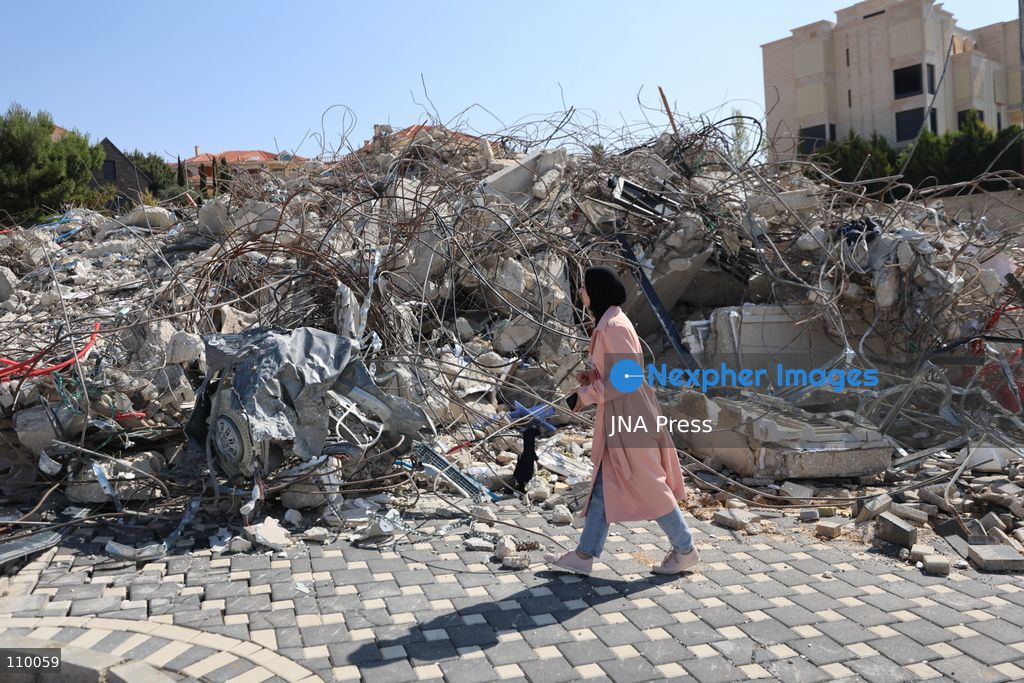HEBRON, PALESTINE, OCTOBER 28, 2026: Dr. Mayar Marish, 23, stands with her husband, Ahmad Marish, outside the rubble of her family’s home in the Farsh al-Hawa area of Hebron in the occupied West Bank. Israeli forces demolished the home on October 23, displacing her family. Mayar had planned to hold her wedding celebration at the house in ten days. (Photo by Mosab shawer/JNA Press via Nexpher Images)