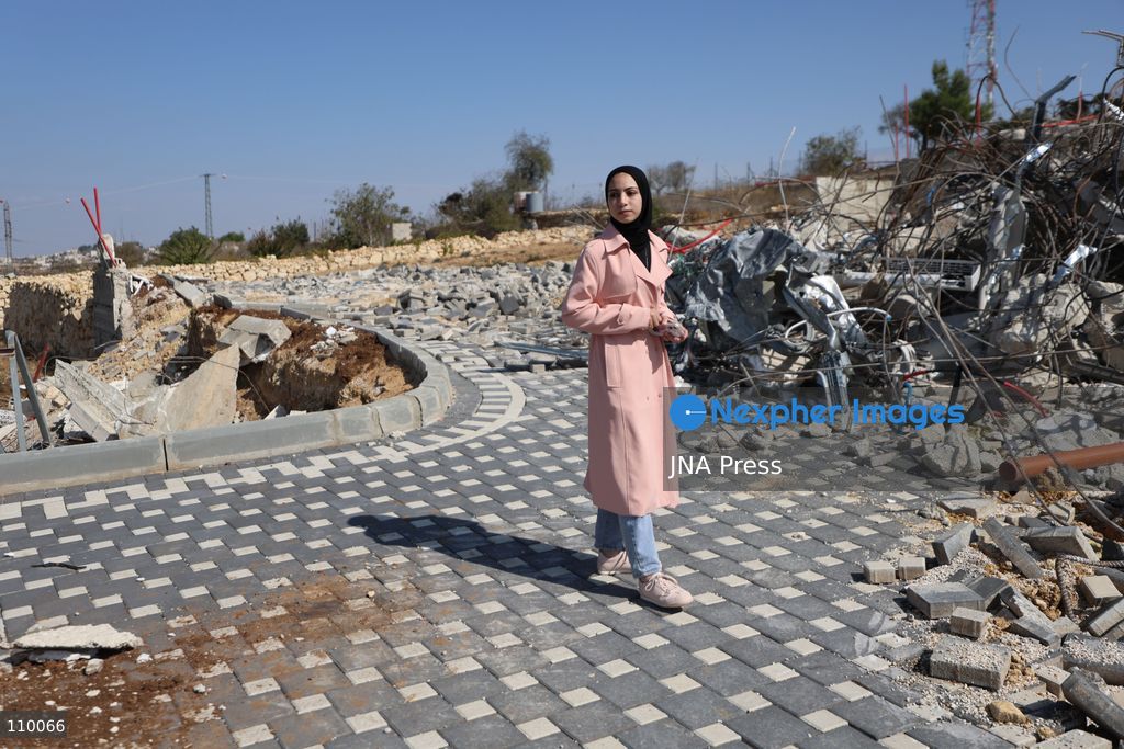 HEBRON, PALESTINE, OCTOBER 28, 2026: Dr. Mayar Marish, 23, stands with her husband, Ahmad Marish, outside the rubble of her family’s home in the Farsh al-Hawa area of Hebron in the occupied West Bank. Israeli forces demolished the home on October 23, displacing her family. Mayar had planned to hold her wedding celebration at the house in ten days. (Photo by Mosab shawer/JNA Press via Nexpher Images)