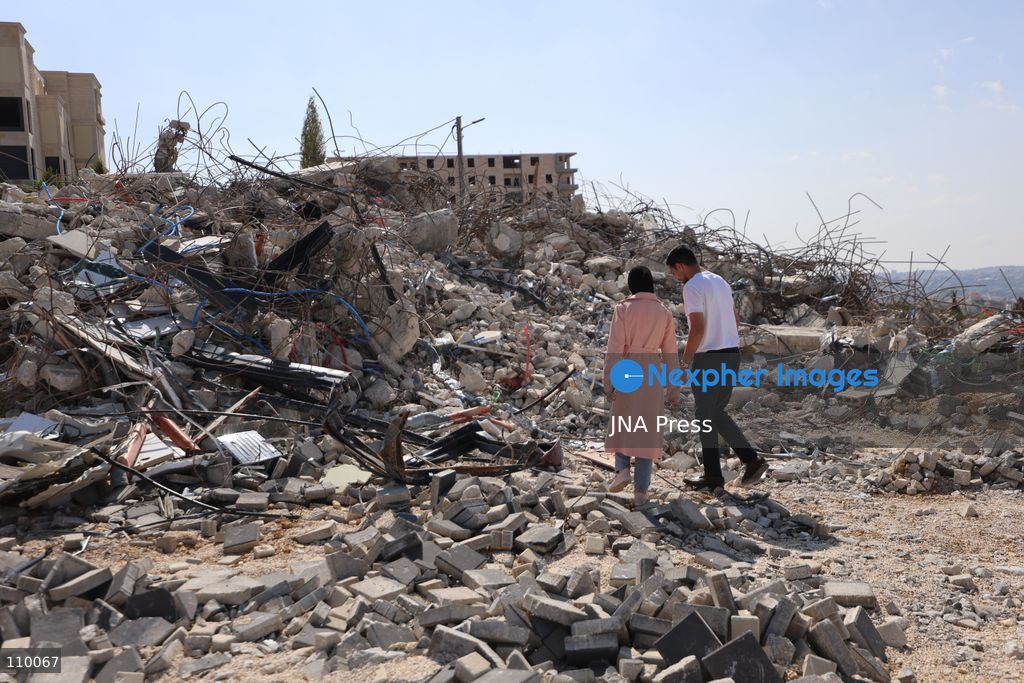 HEBRON, PALESTINE, OCTOBER 28, 2026: Dr. Mayar Marish, 23, stands with her husband, Ahmad Marish, outside the rubble of her family’s home in the Farsh al-Hawa area of Hebron in the occupied West Bank. Israeli forces demolished the home on October 23, displacing her family. Mayar had planned to hold her wedding celebration at the house in ten days. (Photo by Mosab shawer/JNA Press via Nexpher Images)