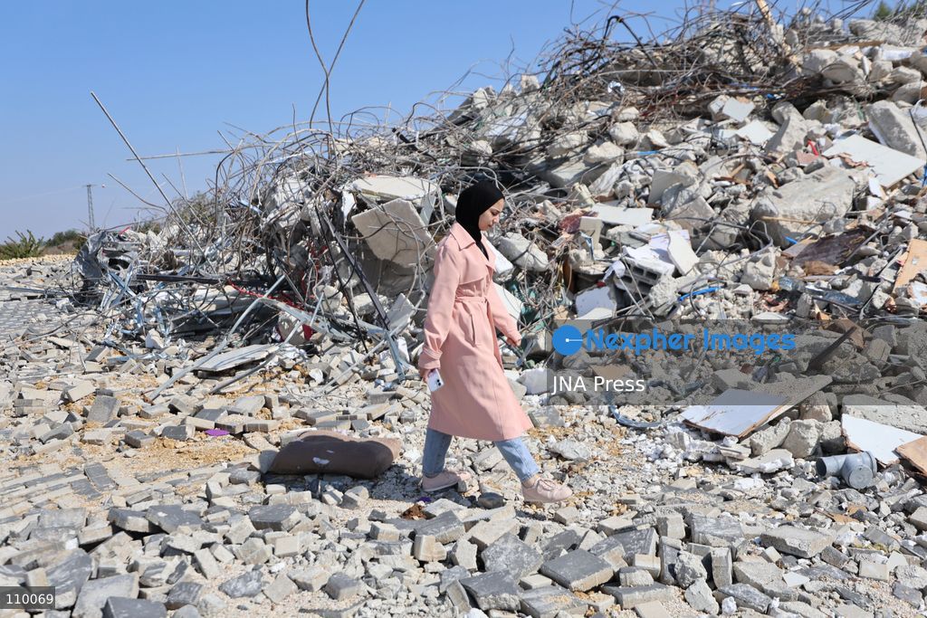 HEBRON, PALESTINE, OCTOBER 28, 2026: Dr. Mayar Marish, 23, stands with her husband, Ahmad Marish, outside the rubble of her family’s home in the Farsh al-Hawa area of Hebron in the occupied West Bank. Israeli forces demolished the home on October 23, displacing her family. Mayar had planned to hold her wedding celebration at the house in ten days. (Photo by Mosab shawer/JNA Press via Nexpher Images)