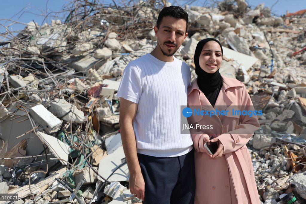 HEBRON, PALESTINE, OCTOBER 28, 2026: Dr. Mayar Marish, 23, stands with her husband, Ahmad Marish, outside the rubble of her family’s home in the Farsh al-Hawa area of Hebron in the occupied West Bank. Israeli forces demolished the home on October 23, displacing her family. Mayar had planned to hold her wedding celebration at the house in ten days. (Photo by Mosab shawer/JNA Press via Nexpher Images)