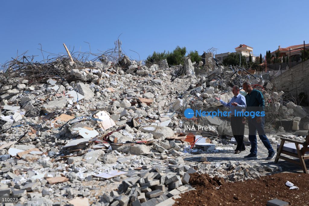 HEBRON, PALESTINE, OCTOBER 28, 2026: Dr. Mayar Marish, 23, stands with her husband, Ahmad Marish, outside the rubble of her family’s home in the Farsh al-Hawa area of Hebron in the occupied West Bank. Israeli forces demolished the home on October 23, displacing her family. Mayar had planned to hold her wedding celebration at the house in ten days. (Photo by Mosab shawer/JNA Press via Nexpher Images)
