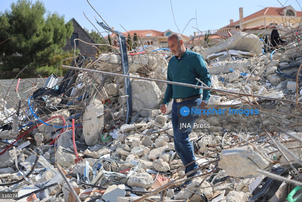 HEBRON, PALESTINE, OCTOBER 28, 2026: Dr. Mayar Marish, 23, stands with her husband, Ahmad Marish, outside the rubble of her family’s home in the Farsh al-Hawa area of Hebron in the occupied West Bank. Israeli forces demolished the home on October 23, displacing her family. Mayar had planned to hold her wedding celebration at the house in ten days. (Photo by Mosab shawer/JNA Press via Nexpher Images)