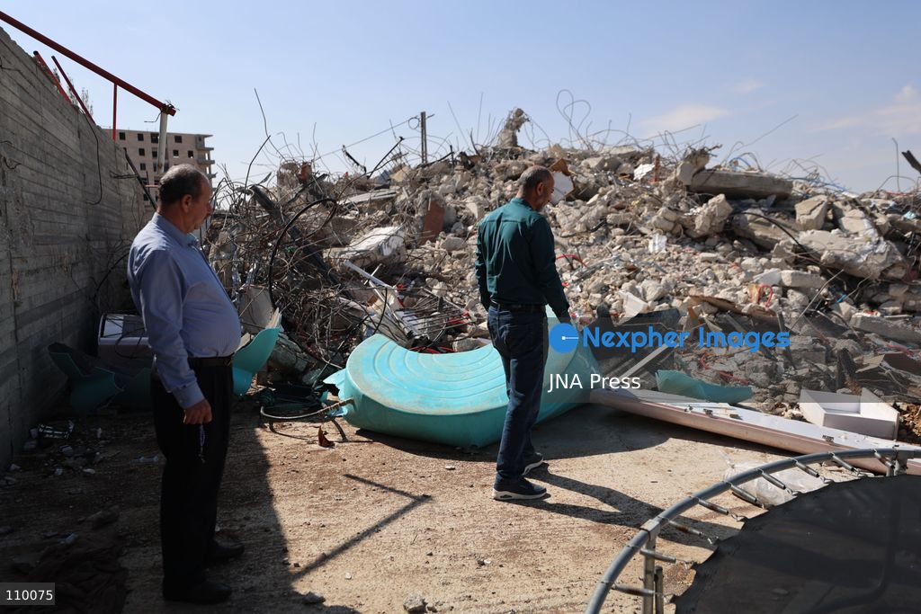 HEBRON, PALESTINE, OCTOBER 28, 2026: Dr. Mayar Marish, 23, stands with her husband, Ahmad Marish, outside the rubble of her family’s home in the Farsh al-Hawa area of Hebron in the occupied West Bank. Israeli forces demolished the home on October 23, displacing her family. Mayar had planned to hold her wedding celebration at the house in ten days. (Photo by Mosab shawer/JNA Press via Nexpher Images)