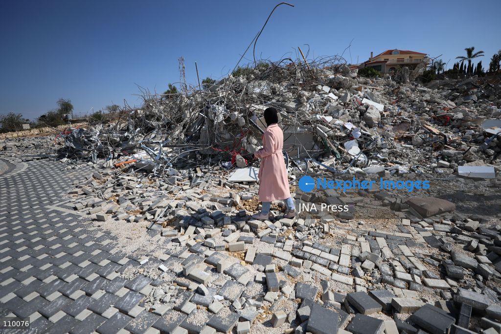 HEBRON, PALESTINE, OCTOBER 28, 2026: Dr. Mayar Marish, 23, stands with her husband, Ahmad Marish, outside the rubble of her family’s home in the Farsh al-Hawa area of Hebron in the occupied West Bank. Israeli forces demolished the home on October 23, displacing her family. Mayar had planned to hold her wedding celebration at the house in ten days. (Photo by Mosab shawer/JNA Press via Nexpher Images)