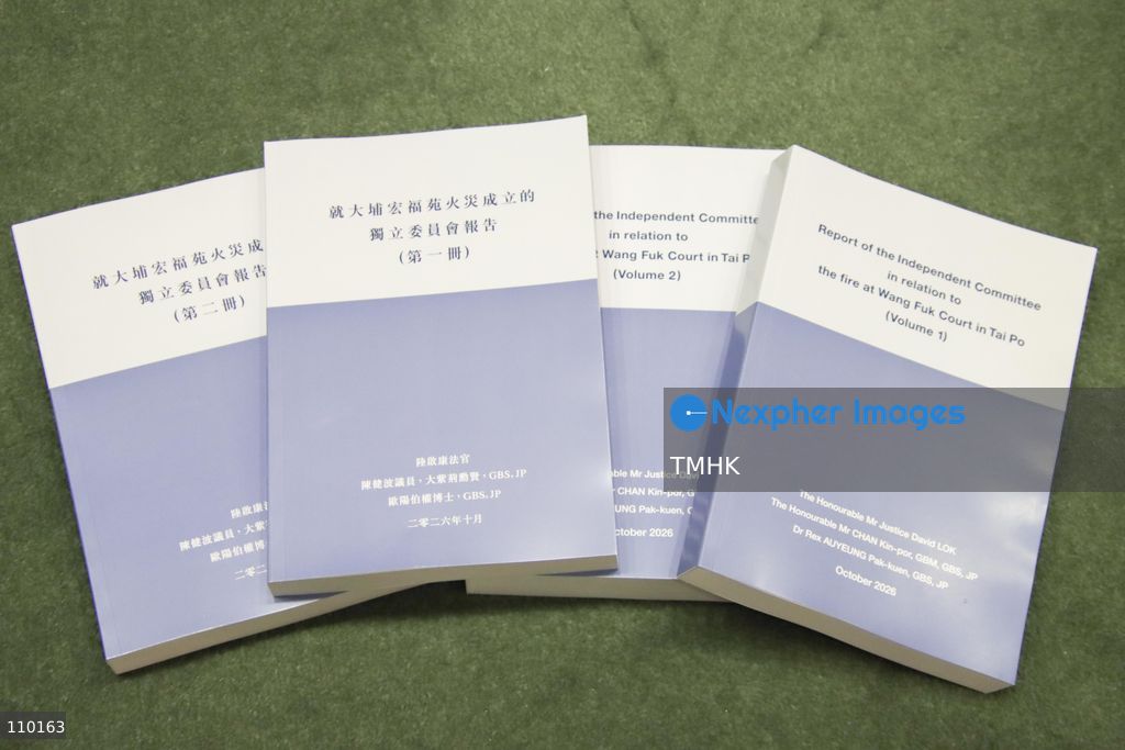 Chinese and English hard copies of the Independent Committee's report on the Wang Fuk Court fire in Tai Po are displayed at the Central Government Offices in Hong Kong on October 29, 2026. The report examines the causes of the November 2025 fire, regulatory shortcomings and recommendations to prevent similar tragedies. (Photo by Gordon Choi/TMHK via Nexpher Images)