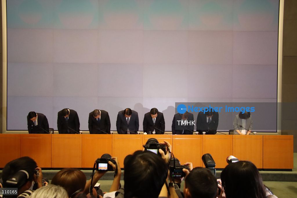 Hong Kong Chief Executive John Lee Ka-chiu, Chief Secretary for Administration Eric Chan Kwok-ki, Financial Secretary Paul Chan Mo-po, Secretary for Justice Paul Lam Ting-kwok, Deputy Financial Secretary and Acting Secretary for Housing Michael Wong Wai-lun, Secretary for Security Chris Tang Ping-keung, Secretary for Labour and Welfare Chris Sun Yuk-han, and Secretary for Development Bernadette Linn Hon-ho bow in apology during a press conference on the independent inquiry report into the deadly Wang Fuk Court fire at the Central Government Offices in Hong Kong on October 29, 2026. The fire in November 2025 claimed 168 lives. (Photo by Gordon Choi/TMHK via Nexpher Images)