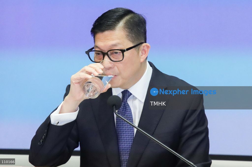 Hong Kong Secretary for Security Chris Tang Ping-keung drinks water during a government press conference on the independent inquiry report into the Wang Fuk Court fire at the Central Government Offices in Hong Kong on October 29, 2026. (Photo by Gordon Choi/TMHK via Nexpher Images)