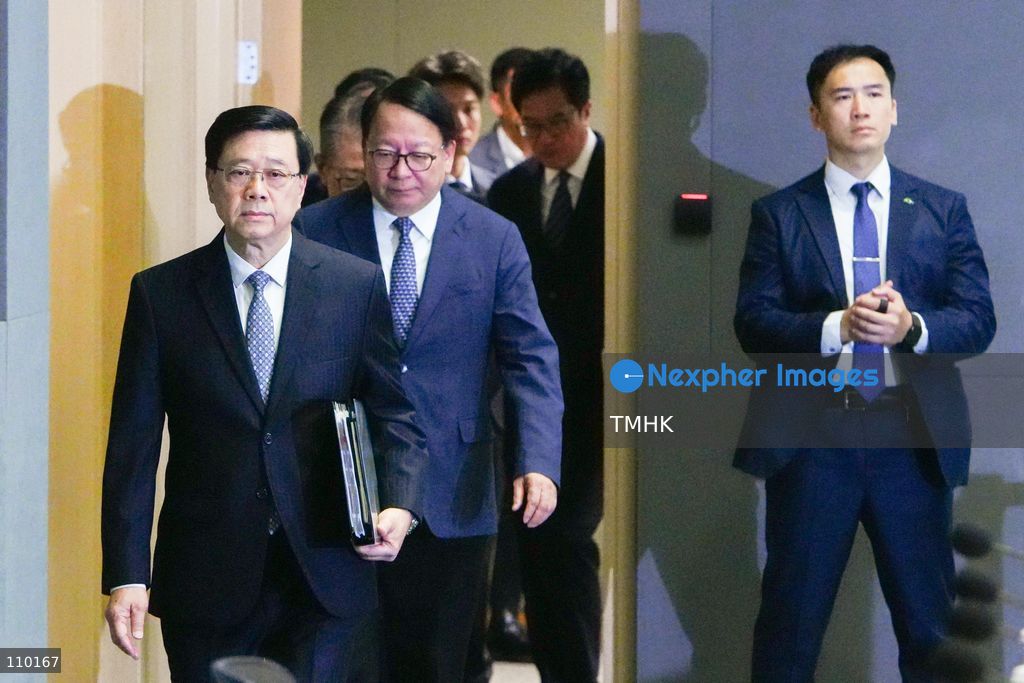 Senior Hong Kong government officials enter the venue for a press conference on the release of the independent inquiry report into the deadly Wang Fuk Court fire at the Central Government Offices in Hong Kong on October 29, 2026. (Photo by Zulu Lo/TMHK via Nexpher Images)
