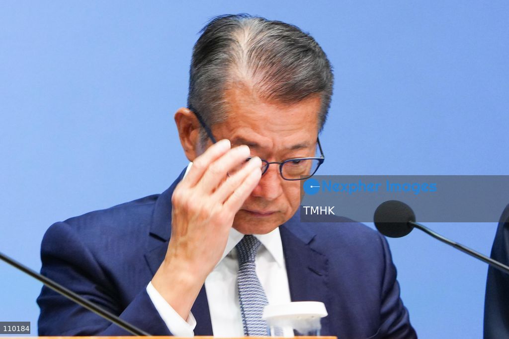 Hong Kong Financial Secretary Paul Chan Mo-po adjusts his glasses during a government press conference on the independent inquiry report into the Wang Fuk Court fire at the Central Government Offices in Hong Kong on October 29, 2026. (Photo by Zulu Lo/TMHK via Nexpher Images)