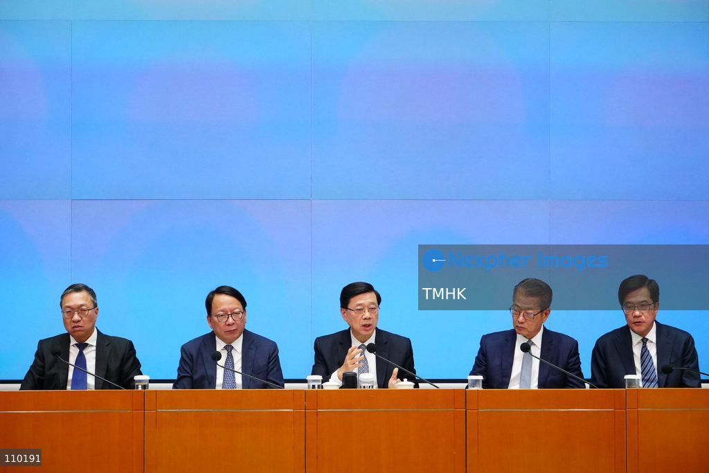 Hong Kong Chief Executive John Lee Ka-chiu answers questions from reporters at the podium during a government press conference on the independent inquiry report into the deadly Wang Fuk Court fire at the Central Government Offices in Hong Kong on October 29, 2026. (Photo by Zulu Lo/TMHK via Nexpher Images)