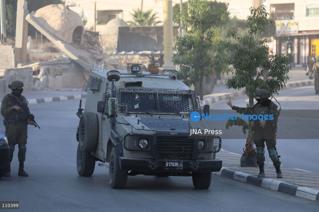 DURA, PALESTINE, OCTOBER 29, 2026: Israeli forces use a military bulldozer to demolish a memorial mural depicting Bajis Abu Atwan in the town of Dura, southwest of Hebron in the occupied West Bank. The demolition takes place during an Israeli military raid on the town. (Photo by Mosab shawer/JNA Press via Nexpher Images)