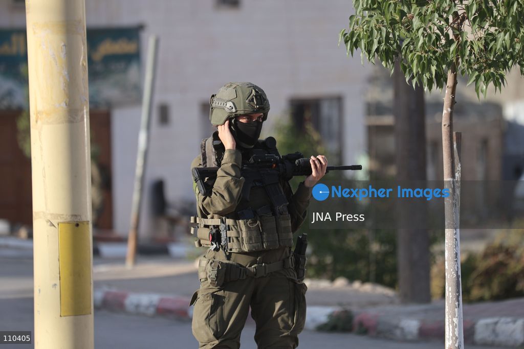 DURA, PALESTINE, OCTOBER 29, 2026: Israeli forces use a military bulldozer to demolish a memorial mural depicting Bajis Abu Atwan in the town of Dura, southwest of Hebron in the occupied West Bank. The demolition takes place during an Israeli military raid on the town. (Photo by Mosab shawer/JNA Press via Nexpher Images)