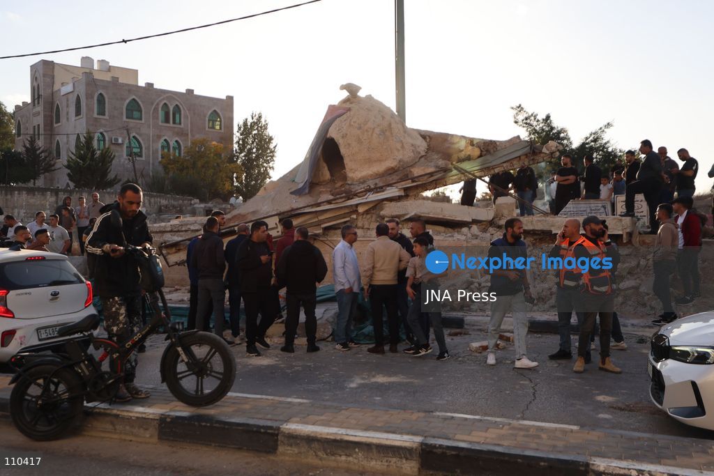 DURA, PALESTINE, OCTOBER 29, 2026: Israeli forces use a military bulldozer to demolish a memorial mural depicting Bajis Abu Atwan in the town of Dura, southwest of Hebron in the occupied West Bank. The demolition takes place during an Israeli military raid on the town. (Photo by Mosab shawer/JNA Press via Nexpher Images)