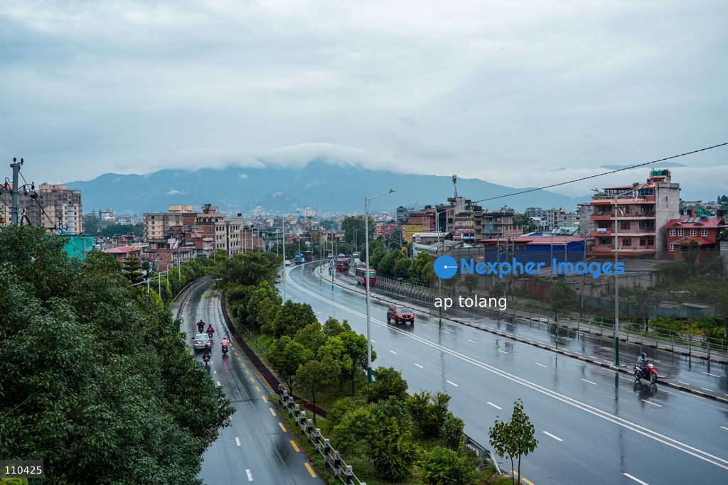 Lalitpur, NEPAL – OCTOBER 30, 2026: Continuous rainfall caused by the remnants of Cyclone Arnab has disrupted daily life in Lalitpur, Nepal. People are seen wearing raincoats and carrying umbrellas as they go about their daily activities amid persistent rain since last night. (Photo by ap tolang/Nexpher Images)