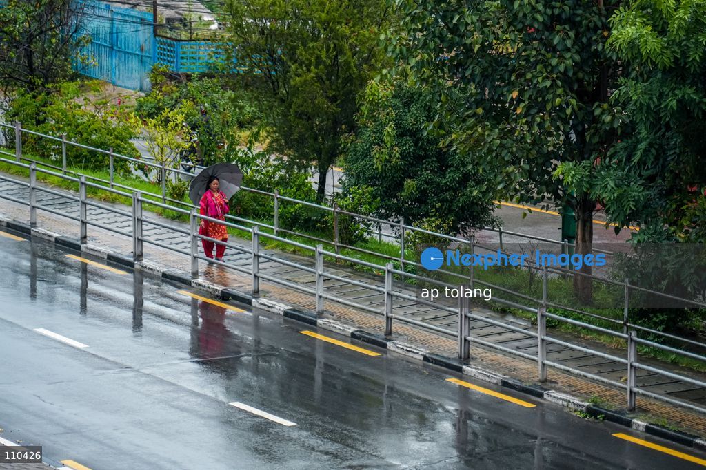 Lalitpur, NEPAL – OCTOBER 30, 2026: Continuous rainfall caused by the remnants of Cyclone Arnab has disrupted daily life in Lalitpur, Nepal. People are seen wearing raincoats and carrying umbrellas as they go about their daily activities amid persistent rain since last night. (Photo by ap tolang/Nexpher Images)