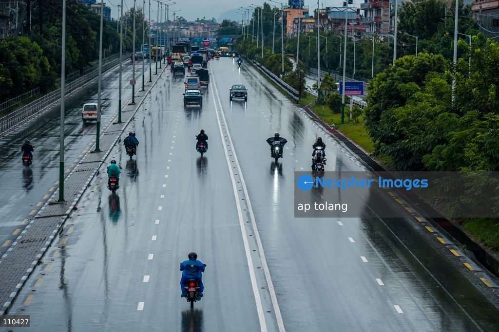 Lalitpur, NEPAL – OCTOBER 30, 2026: Continuous rainfall caused by the remnants of Cyclone Arnab has disrupted daily life in Lalitpur, Nepal. People are seen wearing raincoats and carrying umbrellas as they go about their daily activities amid persistent rain since last night. (Photo by ap tolang/Nexpher Images)