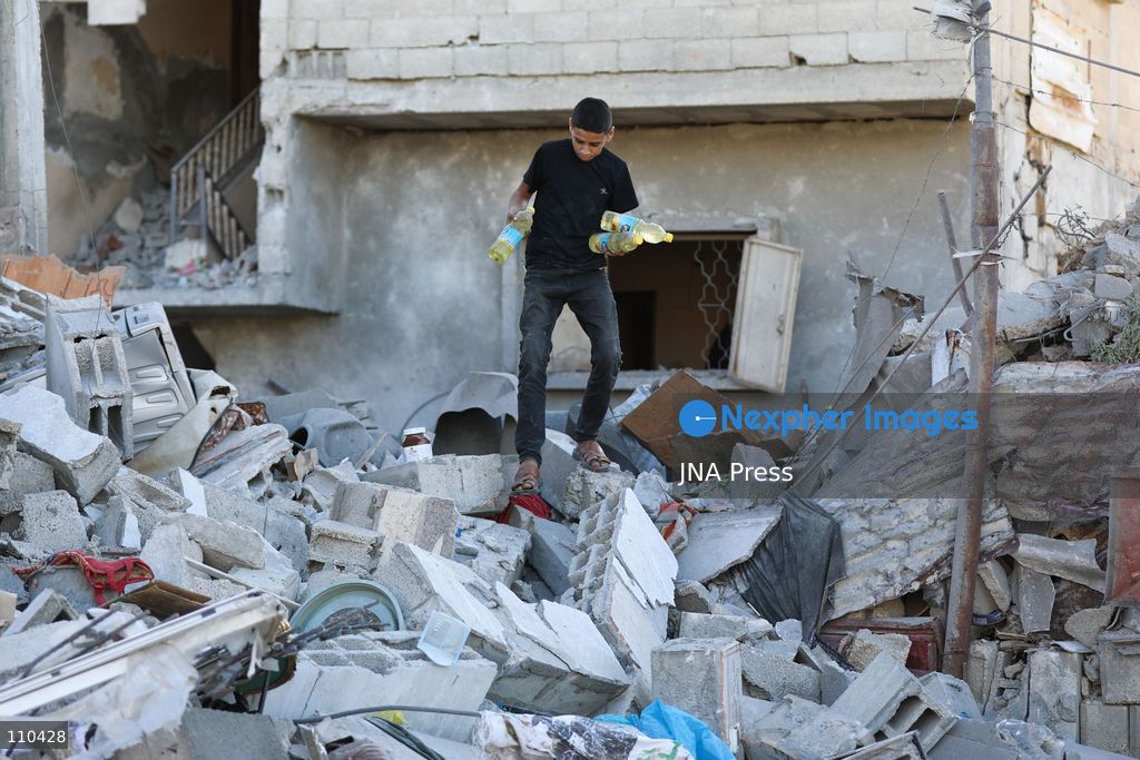 BUREIJ REFUGEE CAMP, PALESTINE, OCTOBER 30, 2026: Rubble covers the site of the al-Qarinawi family’s home following an Israeli airstrike in Bureij refugee camp in the central Gaza Strip. The strike on October 29 destroyed the residential building and caused extensive damage to surrounding homes. (Photo by Ramzi Abu Amer/JNA Press via Nexpher Images)