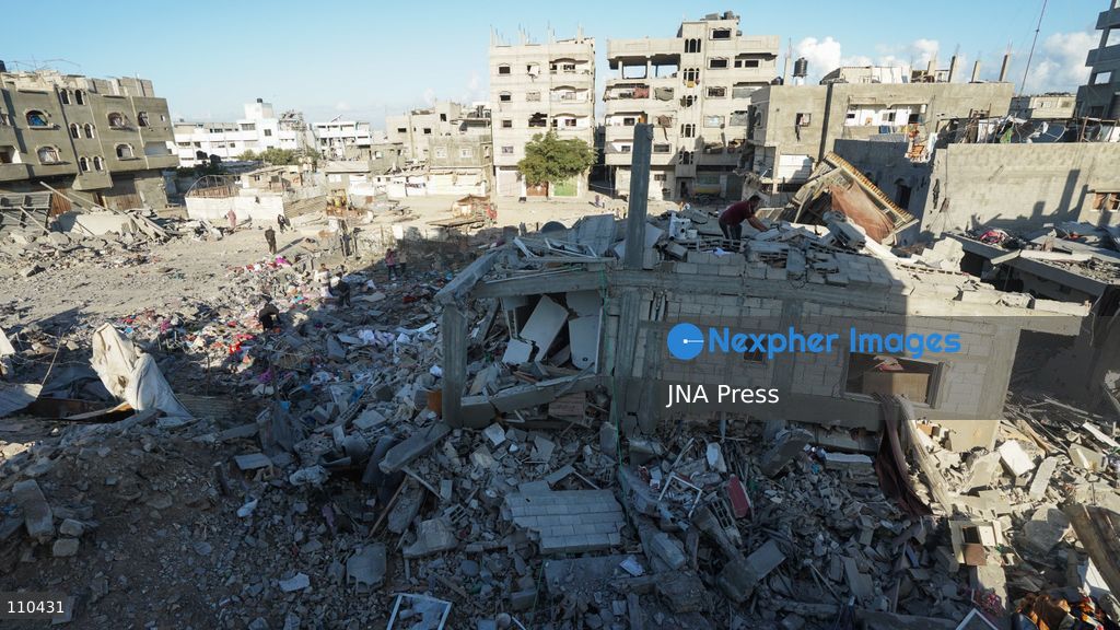 BUREIJ REFUGEE CAMP, PALESTINE, OCTOBER 30, 2026: Rubble covers the site of the al-Qarinawi family’s home following an Israeli airstrike in Bureij refugee camp in the central Gaza Strip. The strike on October 29 destroyed the residential building and caused extensive damage to surrounding homes. (Photo by Ramzi Abu Amer/JNA Press via Nexpher Images)