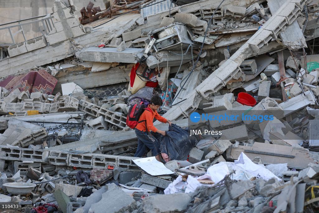 BUREIJ REFUGEE CAMP, PALESTINE, OCTOBER 30, 2026: Rubble covers the site of the al-Qarinawi family’s home following an Israeli airstrike in Bureij refugee camp in the central Gaza Strip. The strike on October 29 destroyed the residential building and caused extensive damage to surrounding homes. (Photo by Ramzi Abu Amer/JNA Press via Nexpher Images)