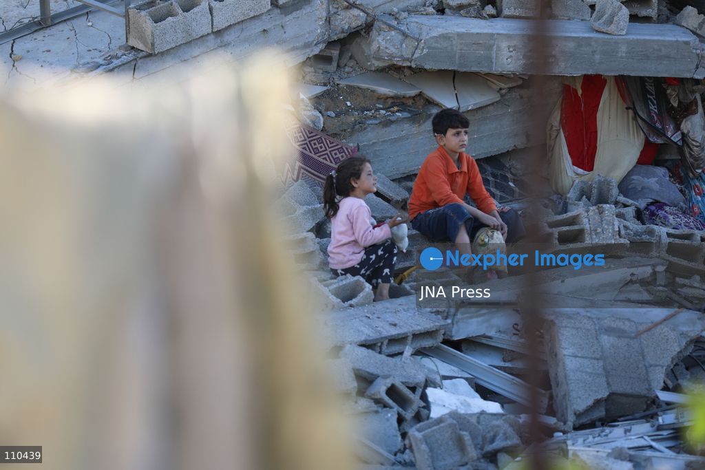 BUREIJ REFUGEE CAMP, PALESTINE, OCTOBER 30, 2026: Rubble covers the site of the al-Qarinawi family’s home following an Israeli airstrike in Bureij refugee camp in the central Gaza Strip. The strike on October 29 destroyed the residential building and caused extensive damage to surrounding homes. (Photo by Ramzi Abu Amer/JNA Press via Nexpher Images)