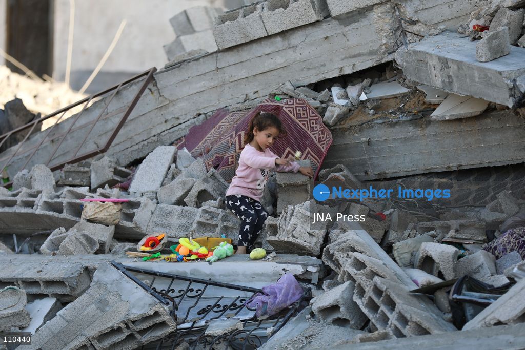 BUREIJ REFUGEE CAMP, PALESTINE, OCTOBER 30, 2026: Rubble covers the site of the al-Qarinawi family’s home following an Israeli airstrike in Bureij refugee camp in the central Gaza Strip. The strike on October 29 destroyed the residential building and caused extensive damage to surrounding homes. (Photo by Ramzi Abu Amer/JNA Press via Nexpher Images)